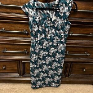 Fitted and lined pattern dress.  Green, black/white.  She size 12